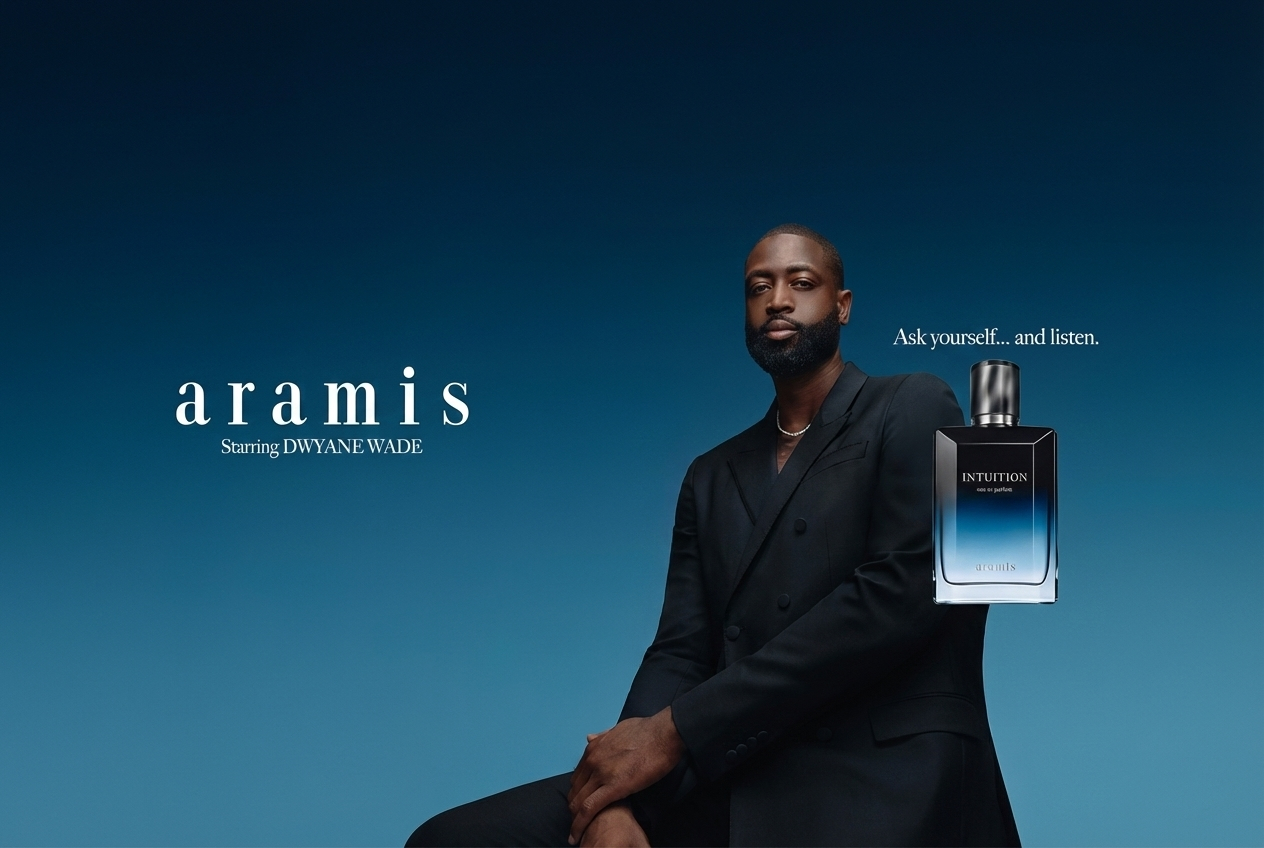 Man in suit holding Aramis